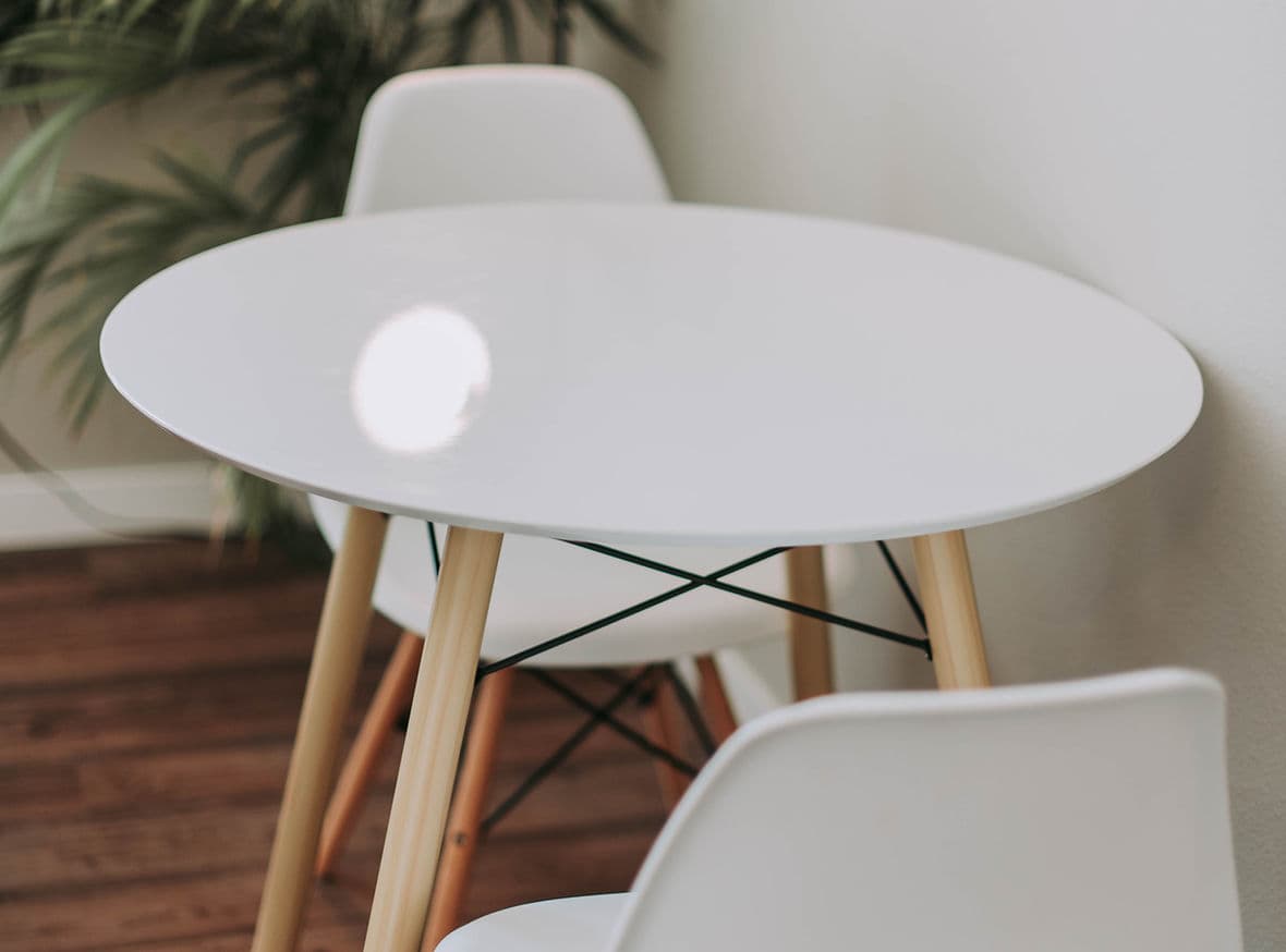 Small white table with two chairs available for delivery